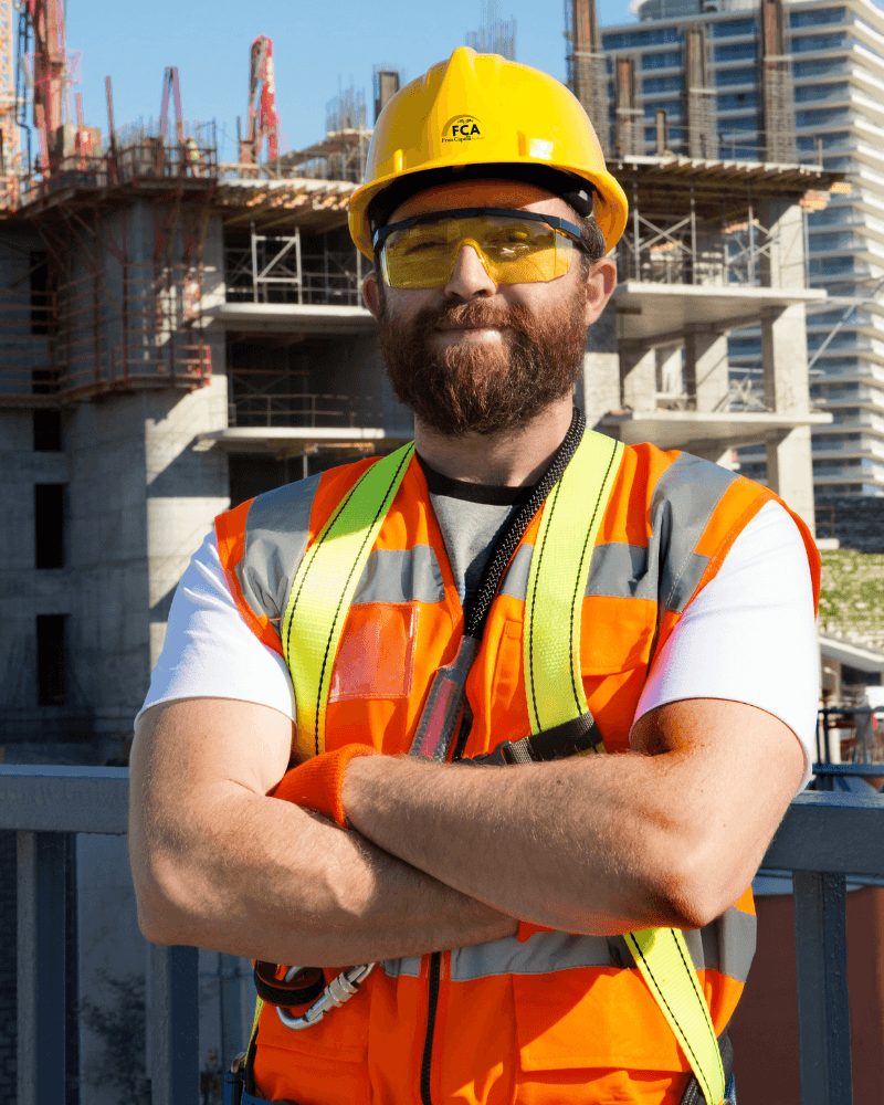 FCA trainer talking with a builder